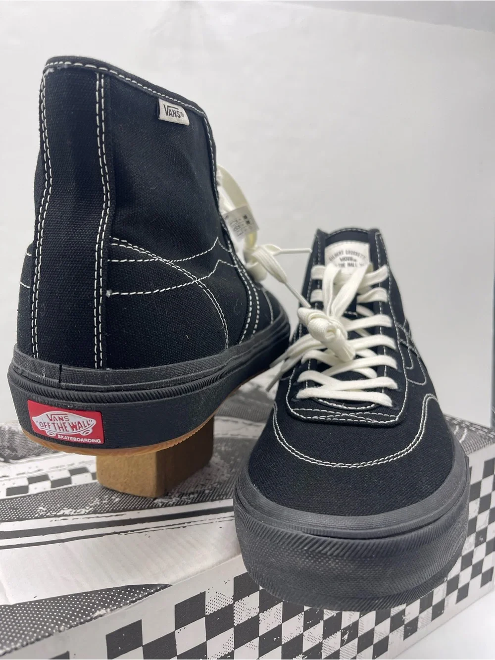Vans Men’s High-Top Canvas Sneakers in Black and White